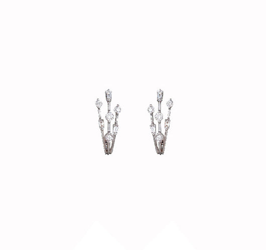 Hoop earrings crafted from 18 karat white gold with diamonds.
